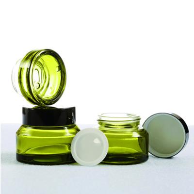 China Customized Cosmetic Glass Amber Green Glass Jar 15g 30g 50g Personal Care Jar For Skin Care Cream for sale