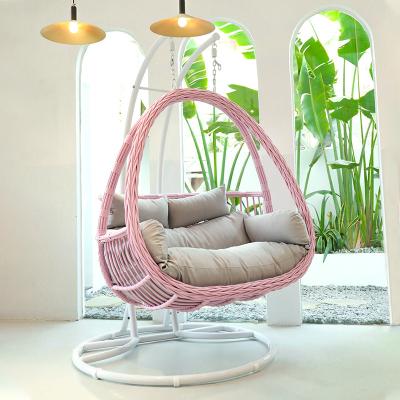 China Beautiful Contemporary Pink Color Rattan Swing Patio Garden In Or Outdoor Egg Seat Basket Cushion Hanging Chair With Stand for sale