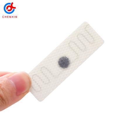 China Waterproof / UHF 860-960mhz White Textile Rfid Laundry Waterproof Woven Woven Cloth Tag for sale