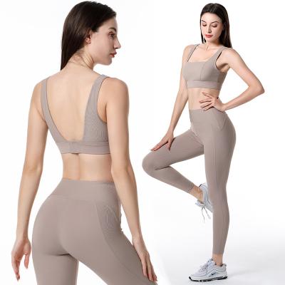 China New Breathable Stretchy Yoga Clothing Top Set Yoga Clothes 2022 For Women Square Neck Backless Solid Bra And Skinny Pencil Gaiters Set for sale