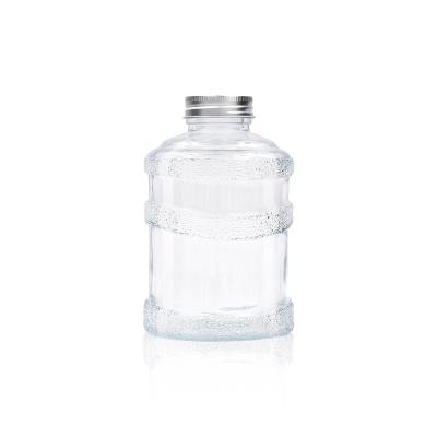 China 500ml Round Shape Luxury Clear Empty Custom Glass Beverage Bottle With Screw Cap For Juice Tea Milk for sale