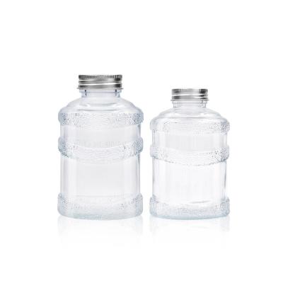 China New Design Beverage Custom Empty Round Shape 350ml 500ml Juice Tea Glass Milk Bottle With Screw Cap for sale