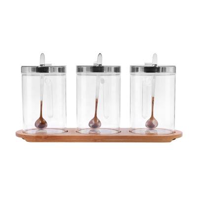 China Hot selling beverage 430ml clear round spice glass jar with spoons for kitchen for sale