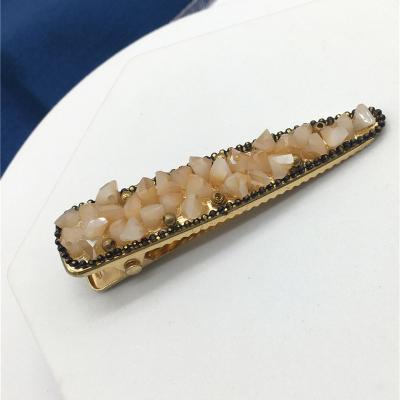 China 60% iron 30% glass 10% brass Solid and durable GOLD PLATING Corocdiles mouthful gold hairclip with stones for sale