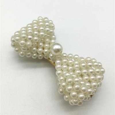 China 70% faux pearl 30% iron Lead the industry Bow knot corocdiles mouthful hairpin pearl knit hairclip for sale