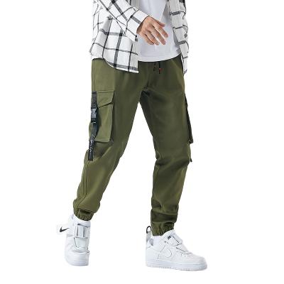 China QUICK DRY Custom LOGO Cargo Pocket Pants Joggers Mens Drawstring Pants Casual Street Wear Plus Size Cargo Sweatpants for sale