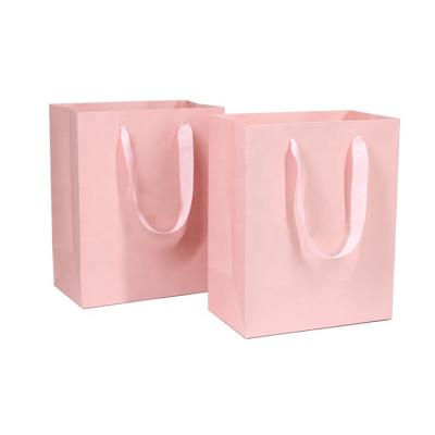 China Recyclable Luxury Ribbon Handle Boutique Shopping Packaging Customized Printed Euro Paper Gift Bags With Logo for sale