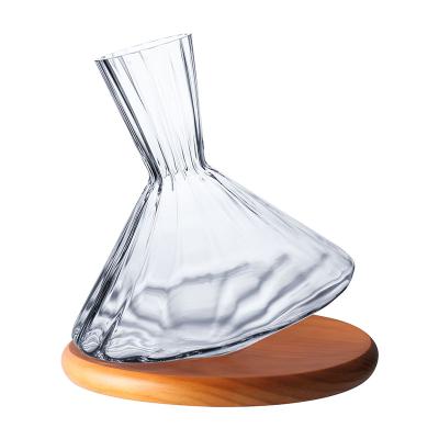 China New Nordic Classic/Postmodern Creative Swing Wine Decanter Household Decanter Wide Edge Tumbler With Wooden Rack for sale