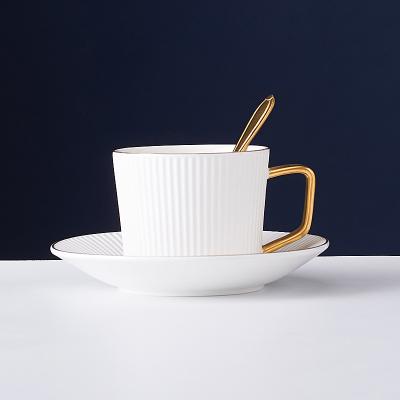 China Latte Vertical Stripes Gold Ceramic Handle Viable Roman Ceramic Cup White Coffee Cup And Saucer for sale