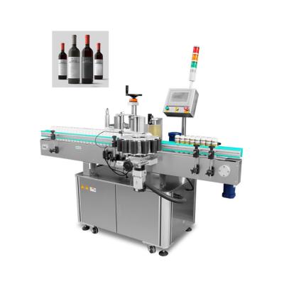 China Food China Factory PLC Control Automatic Wine Around Fix Adhesive Rotary Position Glass Bottle Sticker Labeling Machine for sale