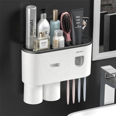 China Two Sustainable Tooth Brushing Cups And Toothpaste Vending Machine Wall Mounted Plastic Toothbrush Holder for sale