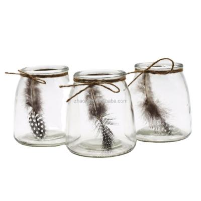 China Feather tied unique clear glass candle holder with feather for sale