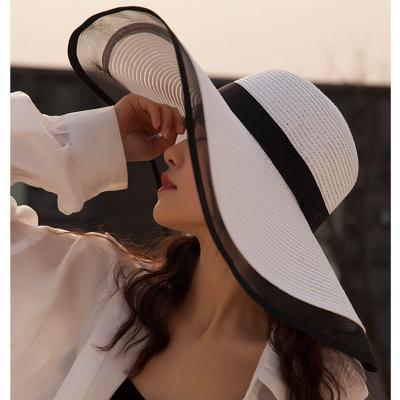 China Hepburn Style Vintage Design Yarn Image Summer Straw Hat Solid Color Beach Vacation Beach Large Sun Hat for sale