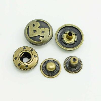 China Custom Engraved Dry Cleaning Logo Metal Round Spring Snap Button for sale