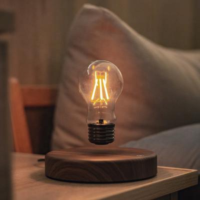 China Modern Minimalist Home Decor Luxury Eye Protect Reading Magnetic Levitation Table Lamp Light Bulb Floating Home Light for sale