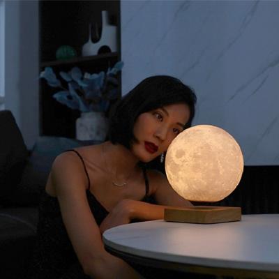 China Cheap Designed Postmodern Minimalist 360 Degree Automatic Rotation Led Magnetic Levitation 18CM Moon Table Lamp for sale