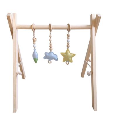 China Hot Sale 2021 Baby Activity Gym New Baby Fitness Frame Foldable Baby Gym Wooden Play Gym With Accessories Wooden Toys for sale