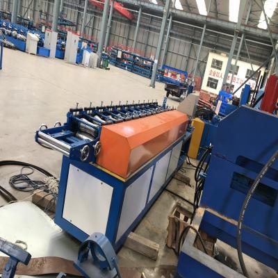 Cina Hydraulic Cutting Chain Driven Shutter Panel Roll Forming Machine Shutter Door Roll Forming System in vendita