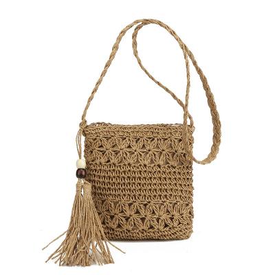 China 2023 New Fashion Tassel Hollow Cross - Body Handwoven Straw Bag Summer Holiday Beach Small Satchel Bag for sale