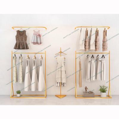 China Double Sided Gold Kids Clothing Store Shelves Hanging Furniture Clothing Racks Wall Mounted Steel Garment Rack for sale