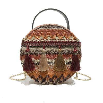 China Fashion Ins Style New Woven Straw Round Bag With Tassels Handmade Shoulder Bag For Women for sale