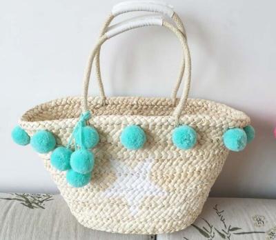 China High Quality Fashion Summer Beach Bag Handmade Straw Bag Designer With Pom Pom for sale