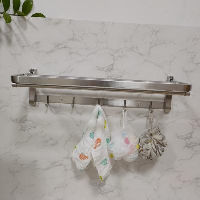 China Durable Popular Folding Towel Rack 304 Stainless Steel Bathroom Towel Shelf Rack With 5 Clothes Hooks for sale