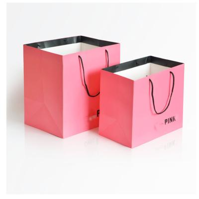 China Recycled Materials Plus Logo Luxury White Paper Bag Retail Boutique Shopping Gift Wholesale Custom Printed Paper Bags With Your Own Logo for sale