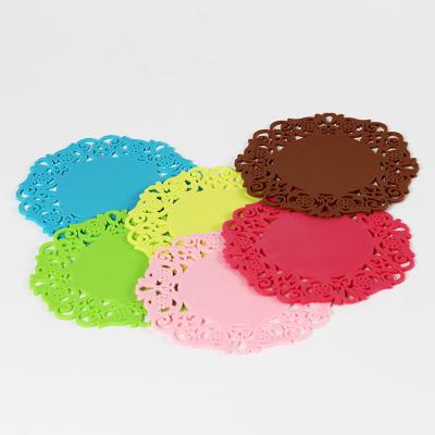 China Sustainable PVC Die Cut Lace Hollowed-out Tea Flower Shaped Placemats Silicone Coaster Cushion Pads for sale