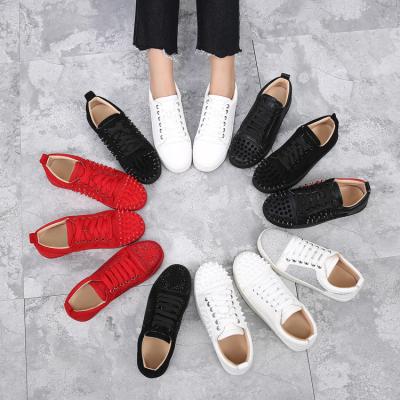 China CUSHIONING shoes 2022 punk glitter skateboard white shoes rivet panel rhinestone leather red bottom women casual shoes for sale