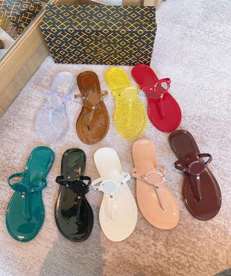 China Fashion Trend PVC Beach Letter Woman Flip Flop Jelly Slippers With Metal Clasp Flat Heels Flip Flops Lady for sale