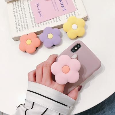 China New M937 Phone Adjustable Universal Plug Stand Bracket Stretch Grip Phone Holder Expanding Finger Cartoon Cute Flower Stand for sale