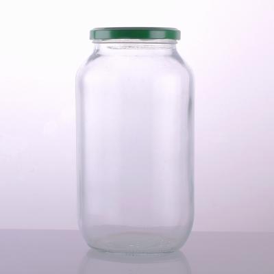 China Steamable High Quality Food Grade Clear Glass Jars Round Glass Bottle Jars Food Glass Jars With Color Metal Lids for sale