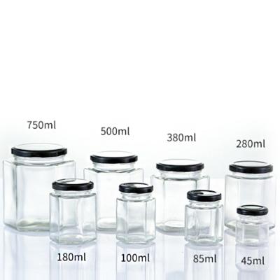 China Home Cheap Price 45ml 100ml 350ml 500ml 1000ml Honey Jar Glass Hexagon Shape Glass Jar With Metal Lids for sale