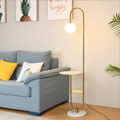 China Nordic modern gold arc metal fancy home decor modern marble floor lamp with table for sale