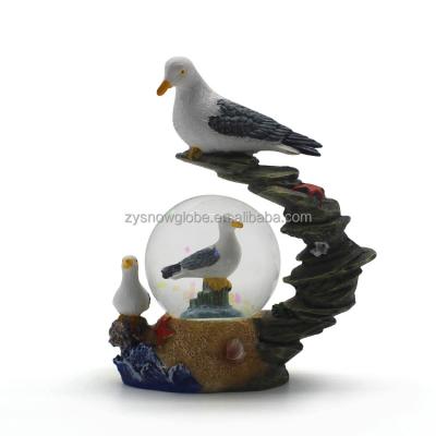 China Public Promotion Polyresin Seagull Snow Globe for sale