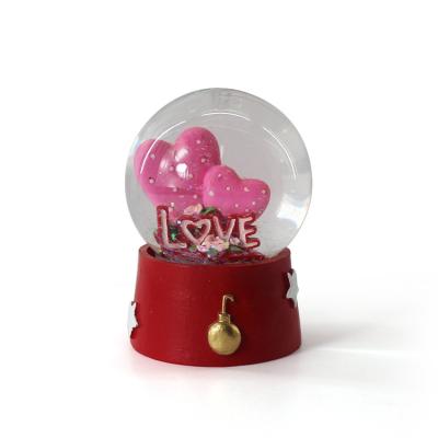 China Public Double Heart Shape Personalized Snow Globe for sale