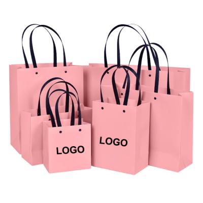 China Factory Customized Pink Recyclable Luxury Flat Paper Handle Difference Types Gift Paper Bags With Logo for sale