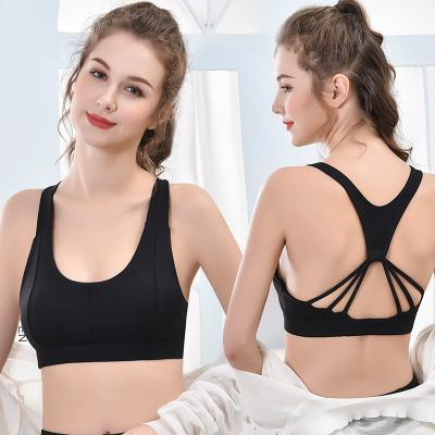 China Padded Breathable Women Plus Size Sports Bra Cross-back Sexy Workout Strappy Seamless Bra For Yoga for sale