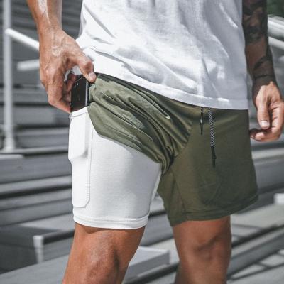 China New Anti-wrinkle mesh men's pants sports men's summer vacation quick-drying running pants two shorts for sale