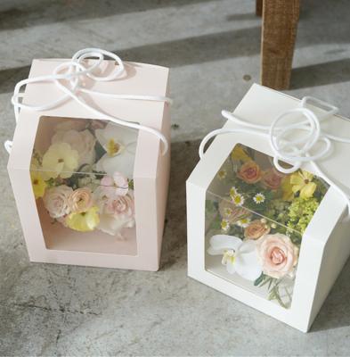 China Best price top quality handmade holiday art paper rose flower box packing with handle for sale