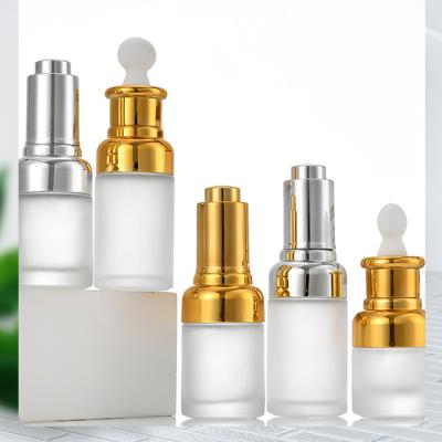 China Cosmetic Custom Clear Frosted Empty Facial Oil Round Glass Bottle With Aluminum Dropper Cap In Bulk for sale