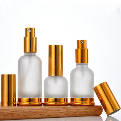 China Cosmetic Custom Transparent Oil Bottle Emulsion Perfume Spray Bottle With Low Dropper Press Glass Bottle for sale