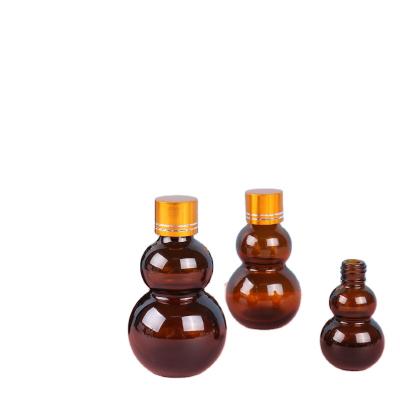 China Cosmetic Squash Spray Bottle Tan Double End Oil Packing Bottle Cosmetics for sale