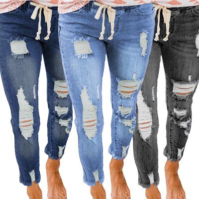 China 2021 new wholesale design QUICK DRY women's jeans hollow out elastic waist hole jeans pants for sale