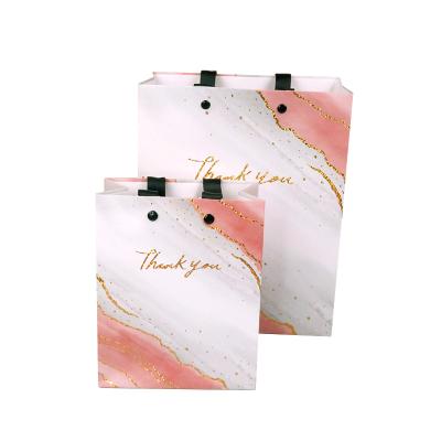 China Exquisite Customized Disposable Gift Bag Handle Paper Gift Packaging Bag Exquisite Paper Organizer With Custom Logo for sale