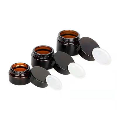 China Personal Care 15g 30g 50g 100g Cosmetic Packaging Amber Glass Cream Jar With Black Aluminum Lid Screw Cap for sale