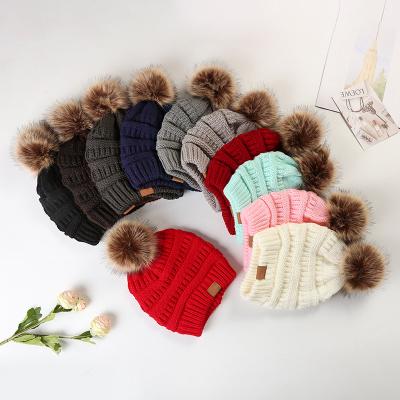 China Winter Waterproof Custom Wholesale Hats Logo Unisex Women Knitted Pom Pom Fur Beanie Hat for sale