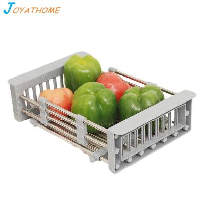 China Expandable Dish Stocked Drying Rack Over The Sink Adjustable Stainless Steel Basket Drainer With Functional Telescopic Arms for sale