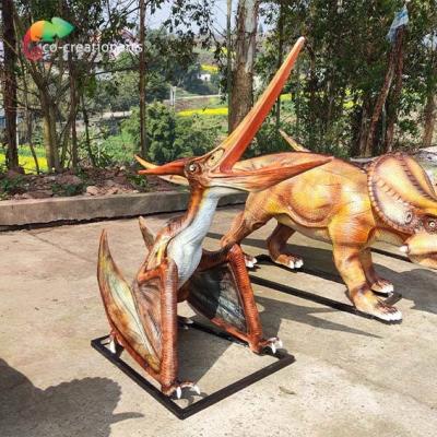 China 3D Fiberglass Realistic Looking Dinosaurs Struggled Pterosauria Statue Outdoor for sale